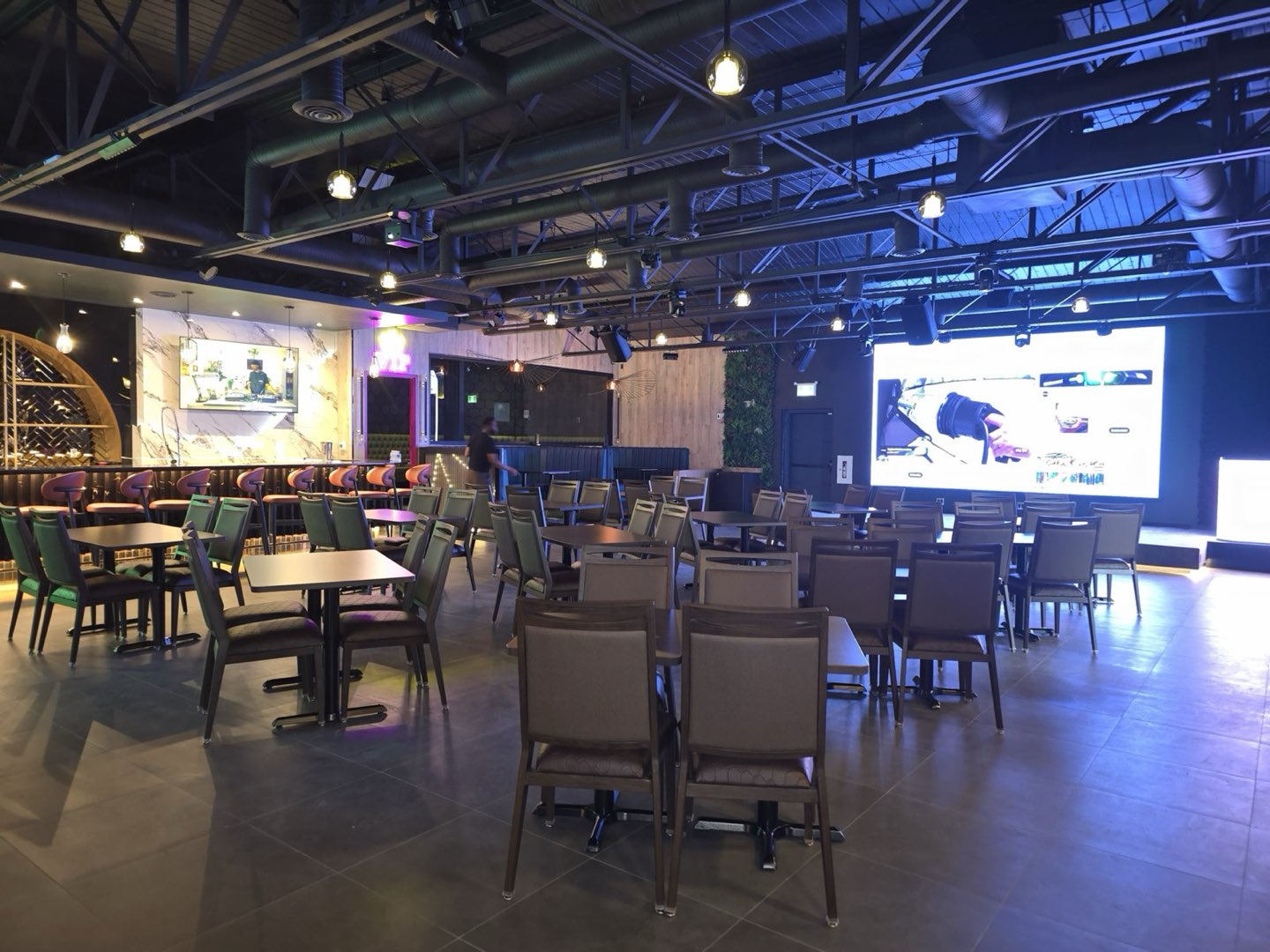 The main hall — stage, LED wall and living plant wall